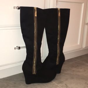 Black suede boots with gold zipper
